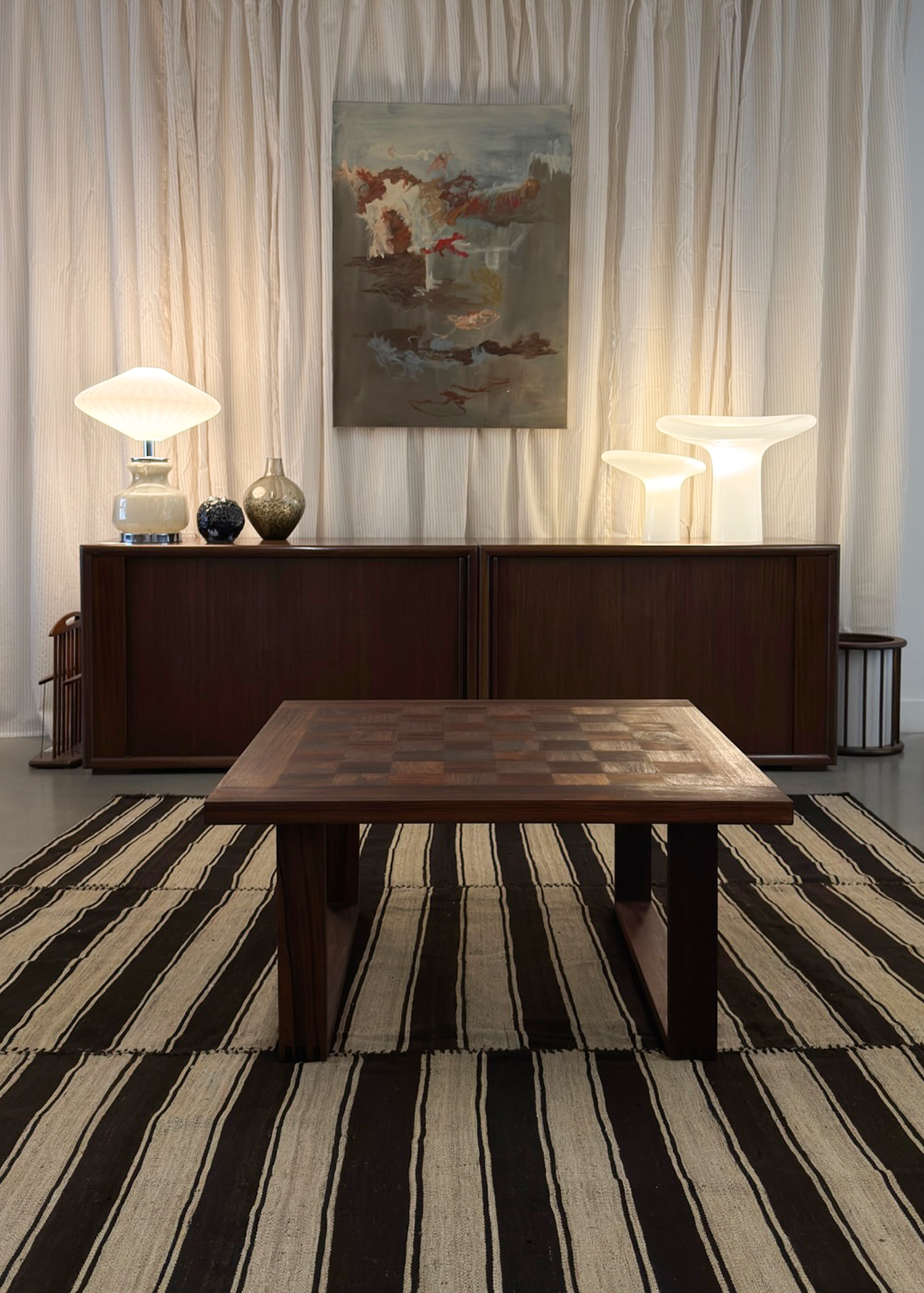 Vintage wool rug with geometric black and cream striped pattern. Mid century modern collectible textile ideal for modern interiors, living rooms, and design spaces