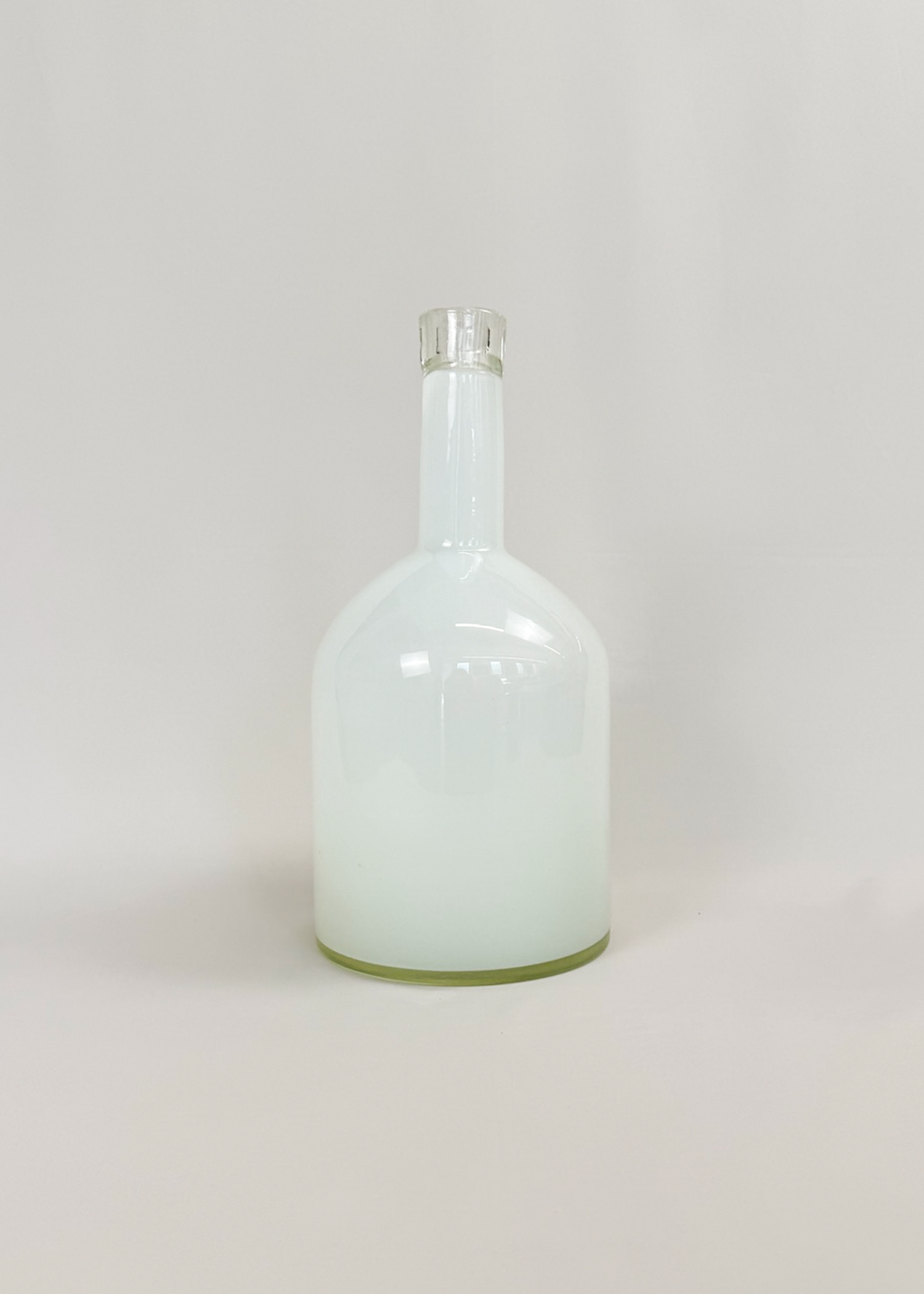 Milked glass vase in frosted white and semi‑opaque finish, sculptural mid century form with organic curves. Collectible decorative object ideal for modern interiors and minimalist styling