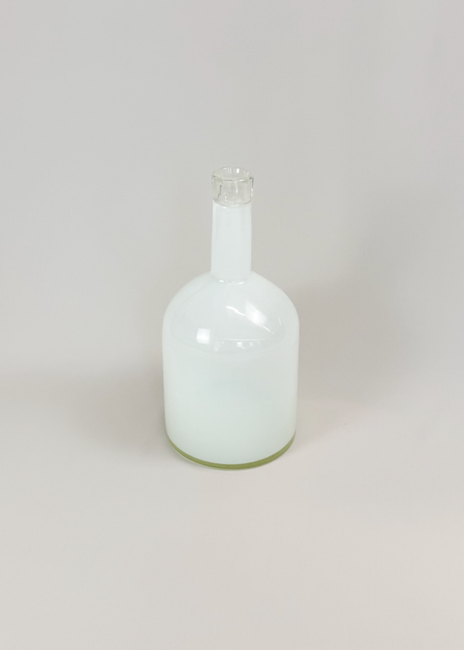Milked glass vase in frosted white and semi‑opaque finish, sculptural mid century form with organic curves. Collectible decorative object ideal for modern interiors and minimalist styling