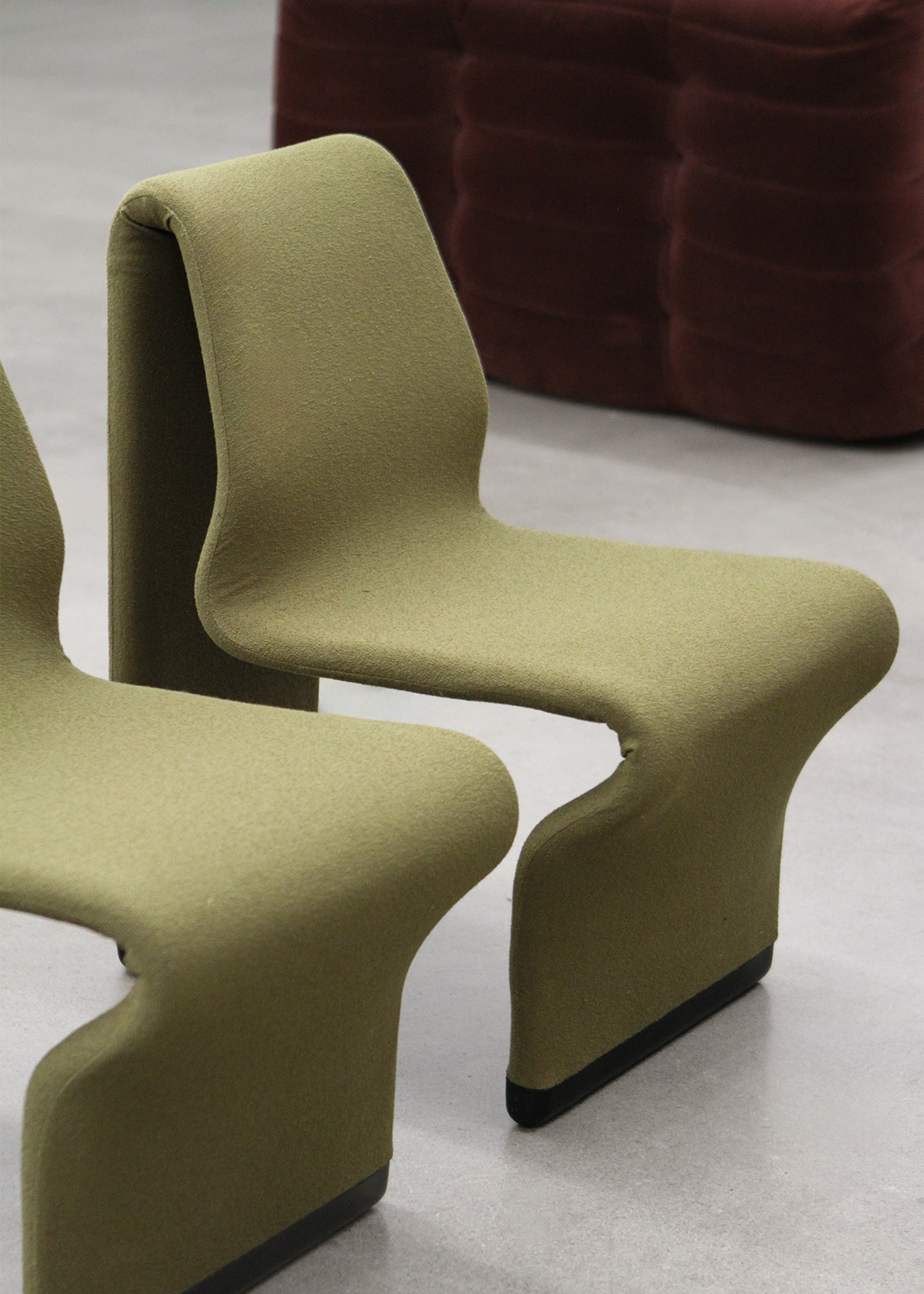 set of two postmodern abstract shaped vintage accent chairs by canadian designer paul boulva upholstered in a wool boucle in a chartreuse green. sold by mid century modern furniture consignment and restoration platform In Corso in Toronto Canada