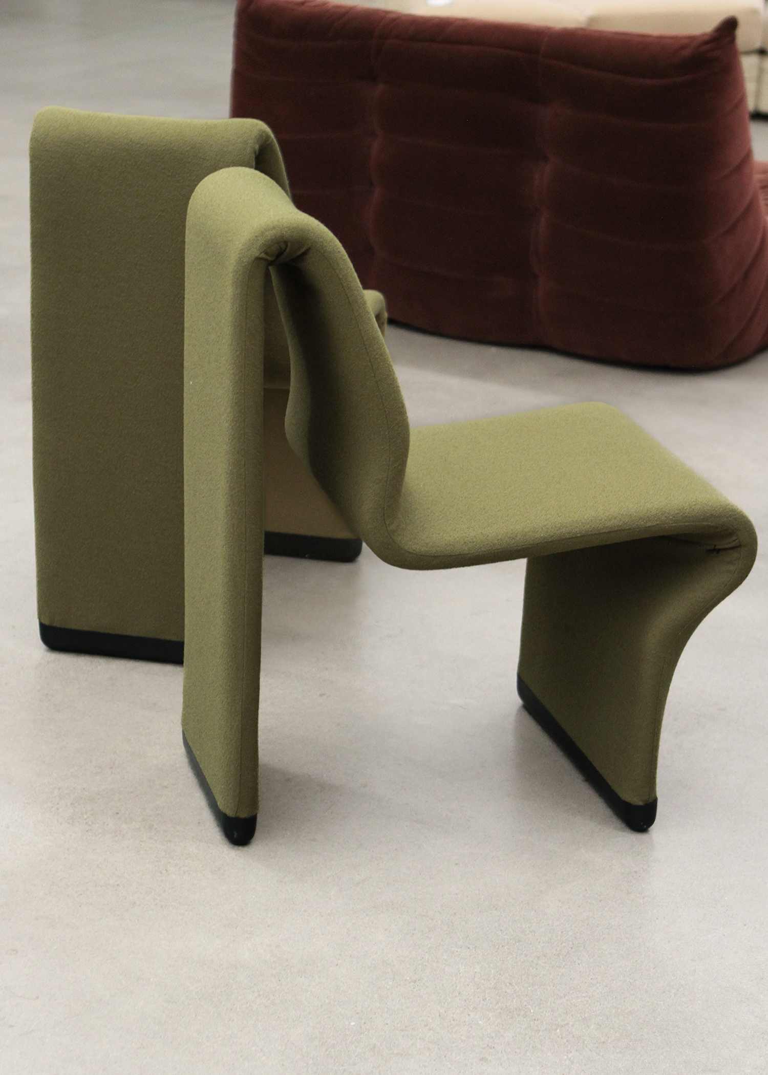 set of two postmodern abstract shaped vintage accent chairs by canadian designer paul boulva upholstered in a wool boucle in a chartreuse green. sold by mid century modern furniture consignment and restoration platform In Corso in Toronto Canada 