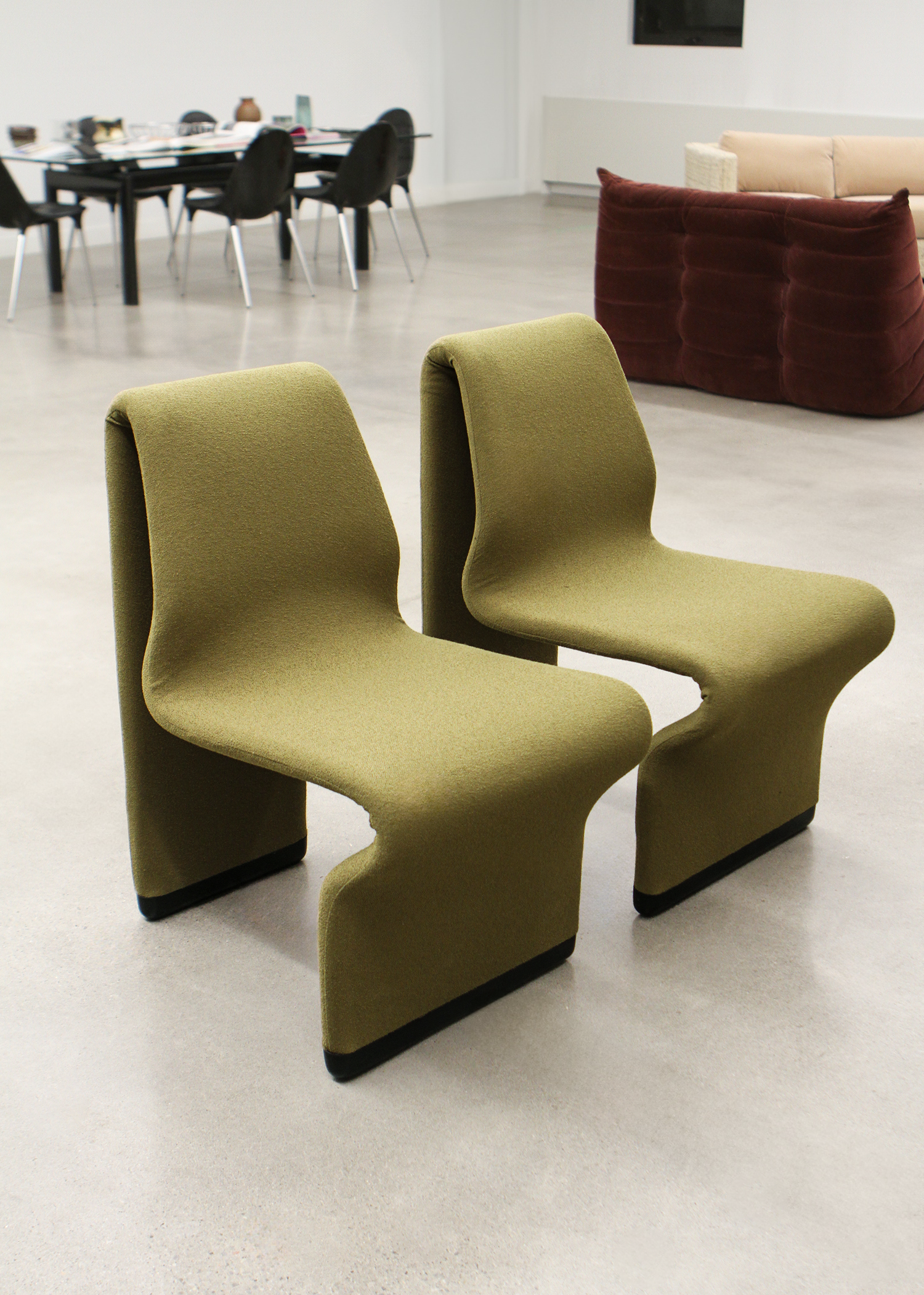 set of two postmodern abstract shaped vintage accent chairs by canadian designer paul boulva upholstered in a wool boucle in a chartreuse green. sold by mid century modern furniture consignment and restoration platform In Corso in Toronto Canada 