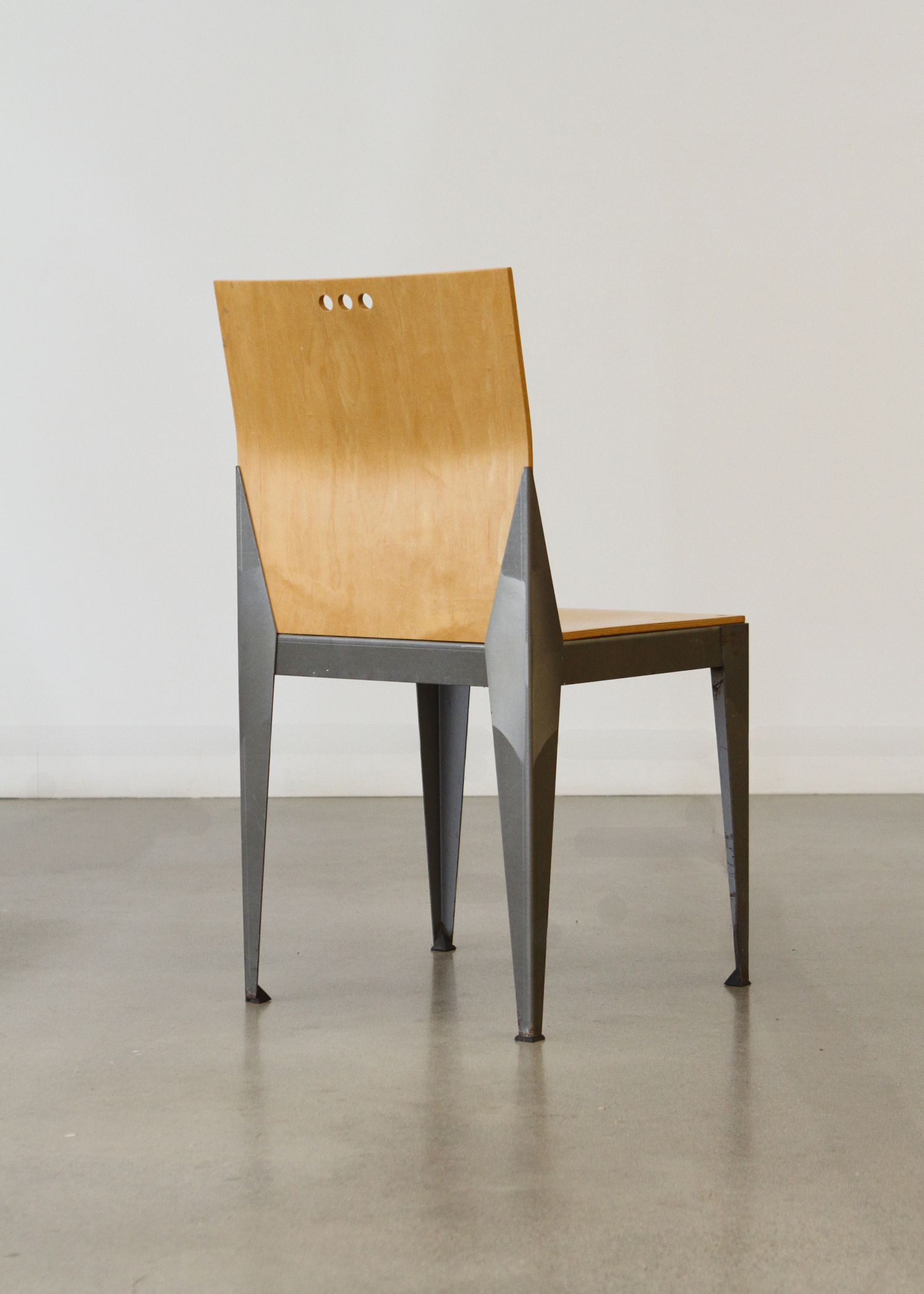 1994 Eli Chair with a sculptural curved bentwood back and round seat, designed with clean lines and a warm natural wood finish. A collectible vintage piece that works as dining seating or an accent chair. Photographed in studio lighting on a neutral backdrop. Available at incorsostudio.com a vintage furniture platform in Toronto.