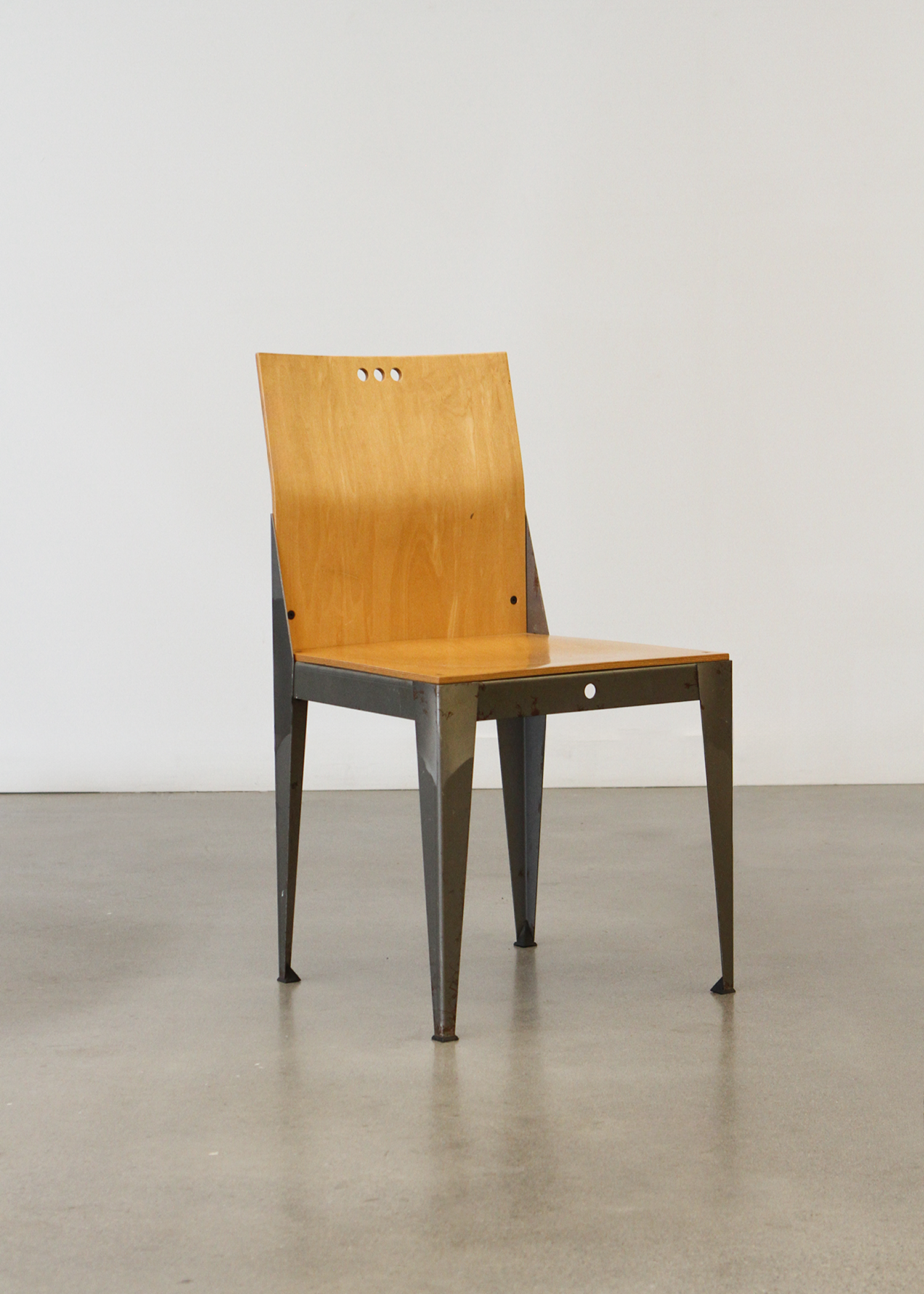 1994 Eli Chair with a sculptural curved bentwood back and round seat, designed with clean lines and a warm natural wood finish. A collectible vintage piece that works as dining seating or an accent chair. Photographed in studio lighting on a neutral backdrop. Available at incorsostudio.com a vintage furniture platform in Toronto.