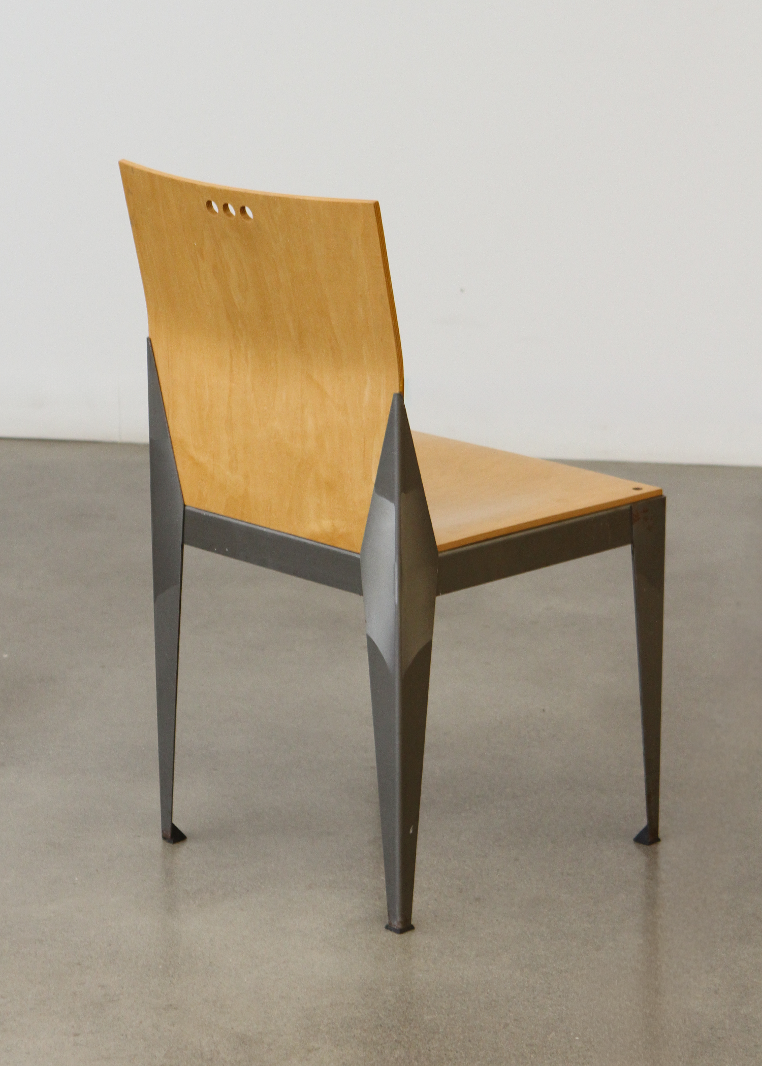 1994 Eli Chair with a sculptural curved bentwood back and round seat, designed with clean lines and a warm natural wood finish. A collectible vintage piece that works as dining seating or an accent chair. Photographed in studio lighting on a neutral backdrop. Available at incorsostudio.com a vintage furniture platform in Toronto.