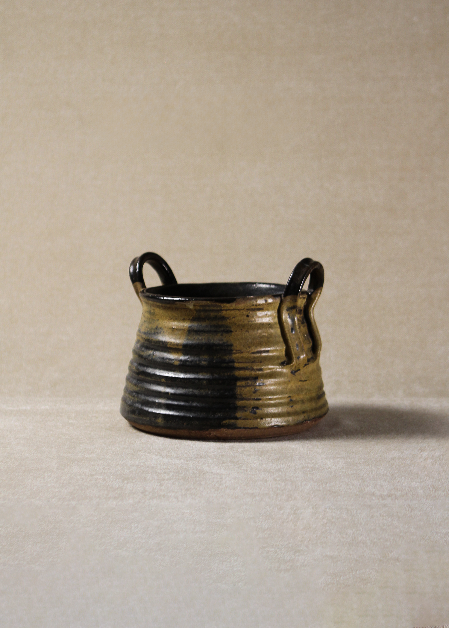 Vintage glazed ceramic bowl with handles