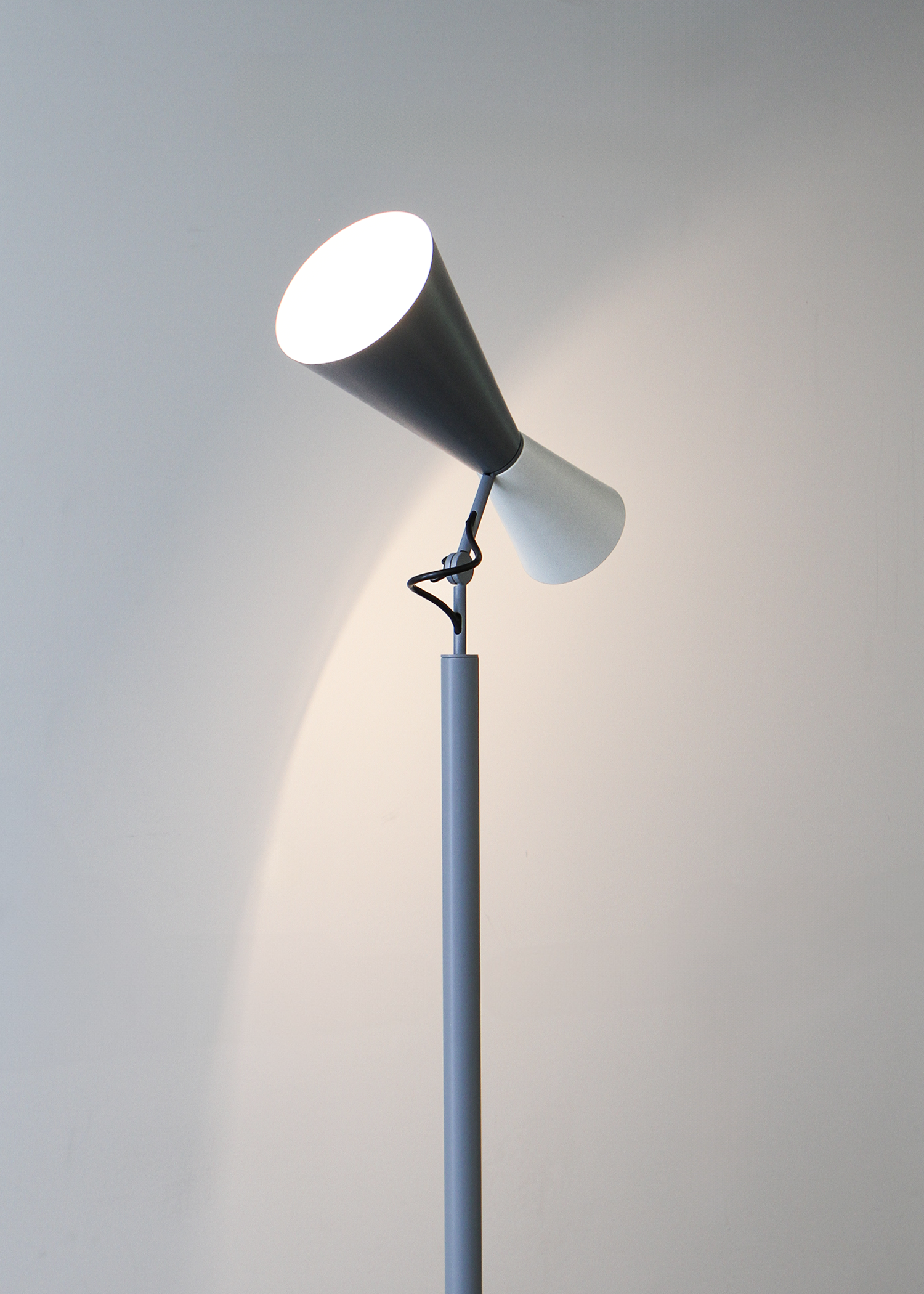 Parliament floor lamp by Le Corbusier for Nemo Lighting, adjustable dual‑cone aluminum diffusers in painted finish casting both direct and indirect light. Sold by In Corso Studio a vintage furniture company specializing in rare mid century furniture in Toronto Canada.