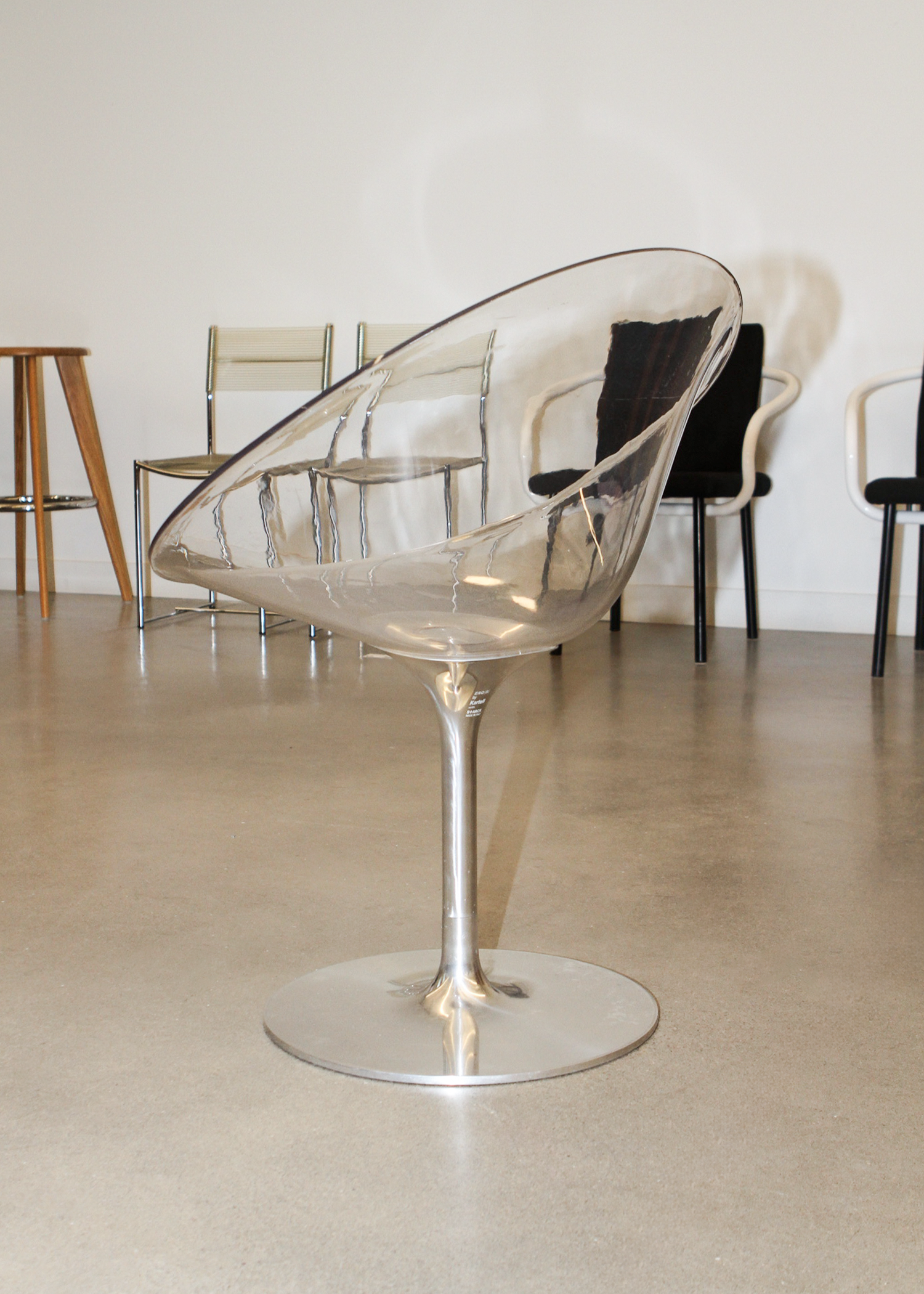 Ero|S| swivel armchair by Philippe Starck for Kartell: clear polycarbonate shell and cast-aluminium tulip base, egg-shaped seating form. Available at vintage furniture platform In Corso – incorsostudio.com. in toronto canada 
