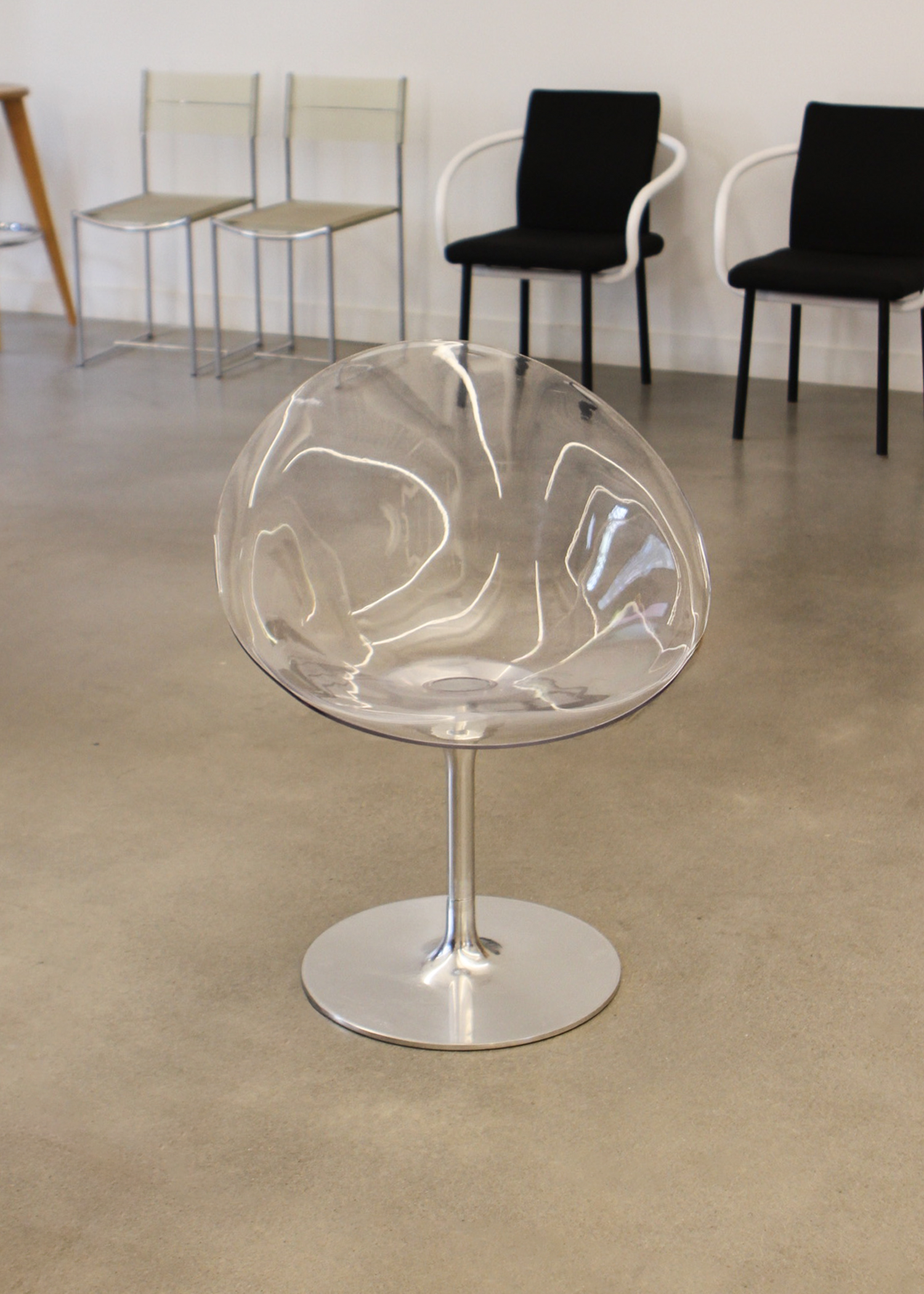 Ero|S| swivel armchair by Philippe Starck for Kartell: clear polycarbonate shell and cast-aluminium tulip base, egg-shaped seating form. Available at vintage furniture platform In Corso – incorsostudio.com. in toronto canada 