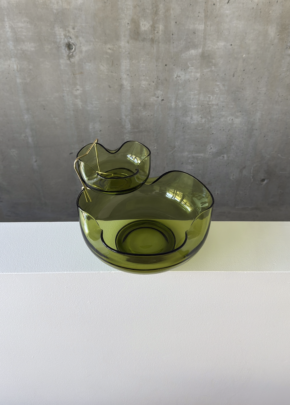 Green bowl chip and dip bowl by Anchor Hocking. Shown on In Corso Studio, a vintage furniture platform in Toronto.